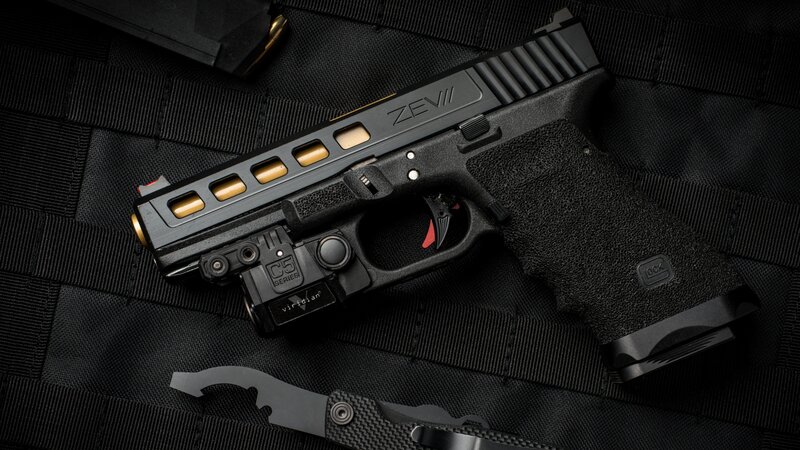 Black Handgun with Gold Accents