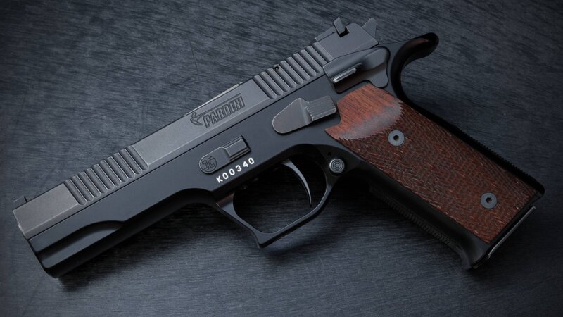 Black Handgun with Wood Grip — Dramatic