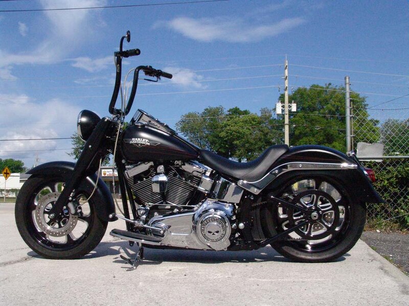 Black Harley-davidson Motorcycle — Calm, Afternoon, Photograph, Chain-link Fence