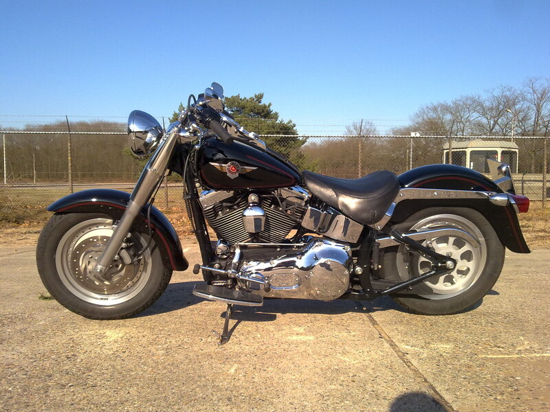 Black Harley-davidson Motorcycle — Calm, Afternoon, Photograph, Fence