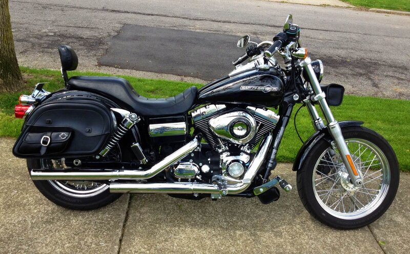 Black Harley-Davidson Motorcycle — Calm, Afternoon, Photograph, Saddlebags, Chrome Exhaust, Windshield