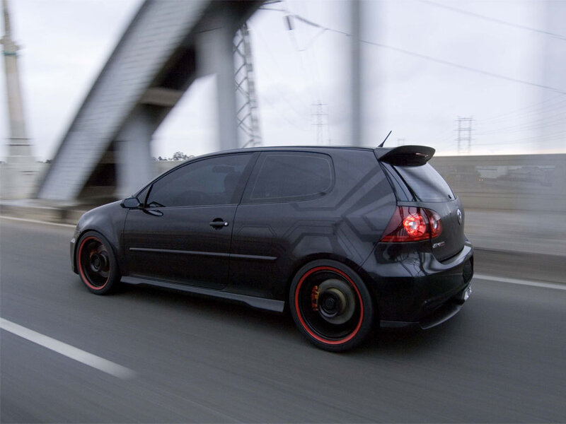 black hatchback car in motion