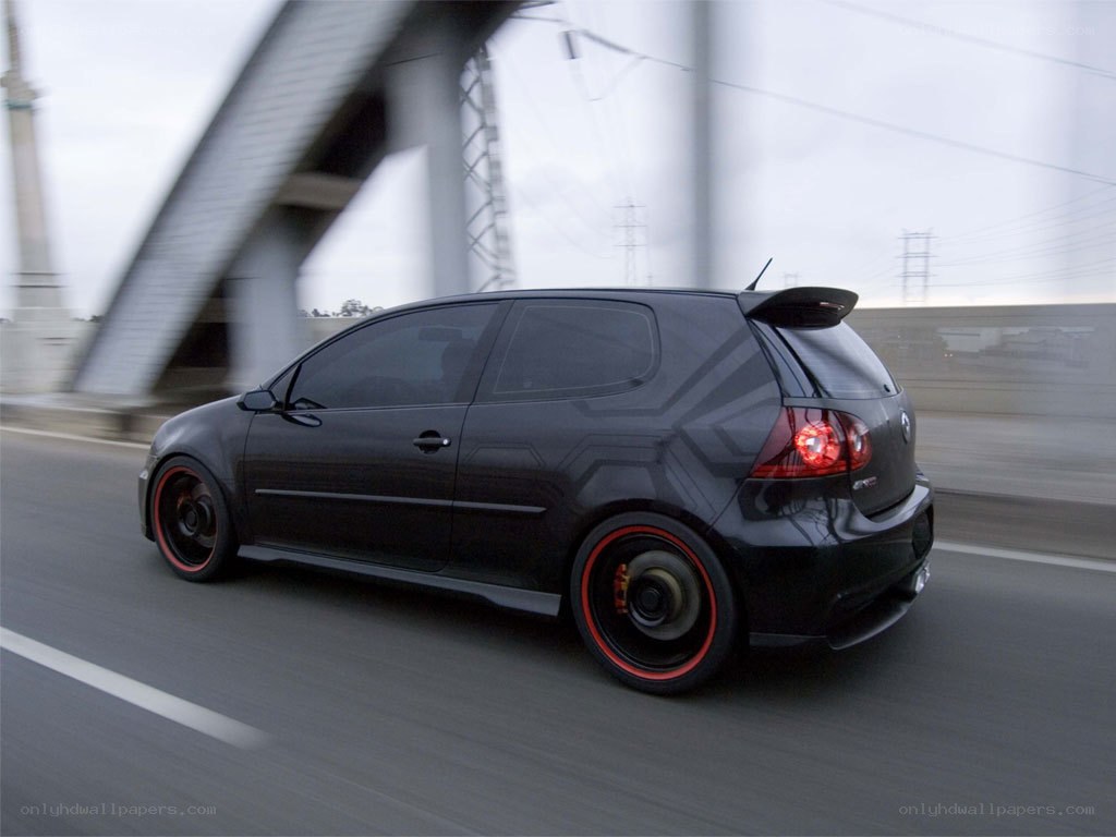 black hatchback car in motion