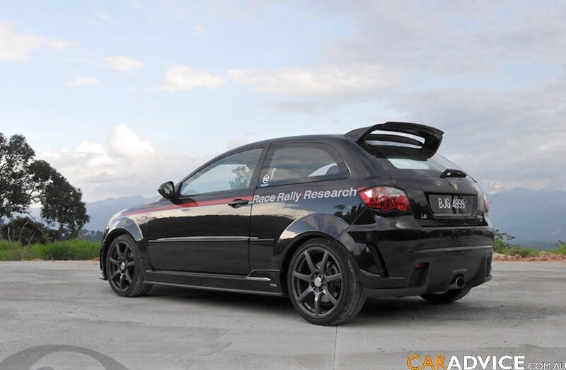 black hatchback with racing decals