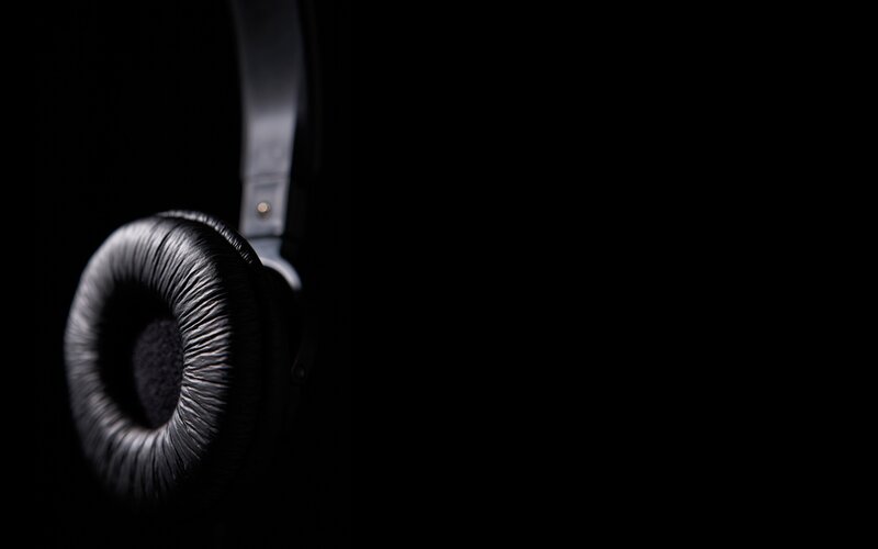 black headphones on dark background