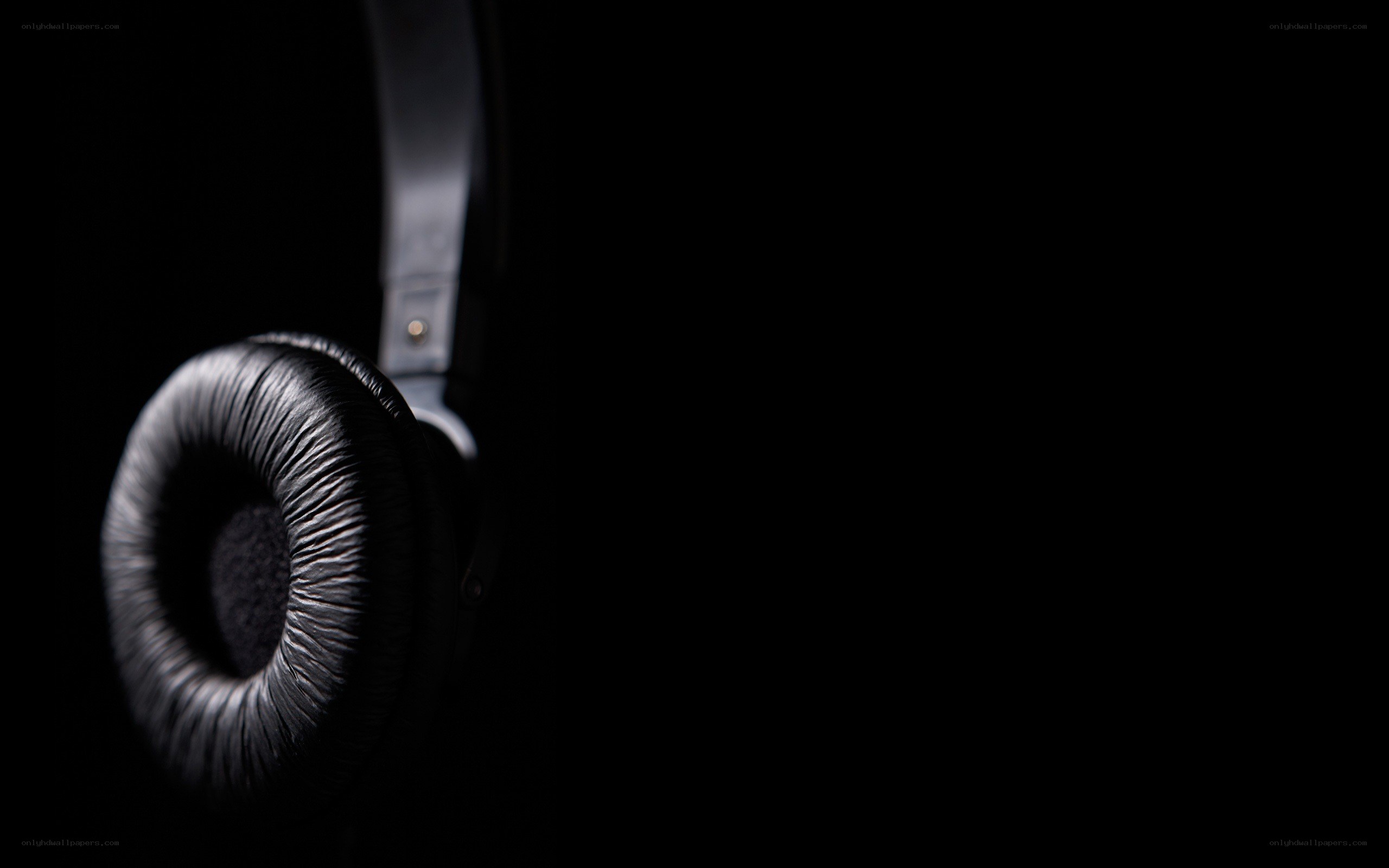 black headphones on dark background