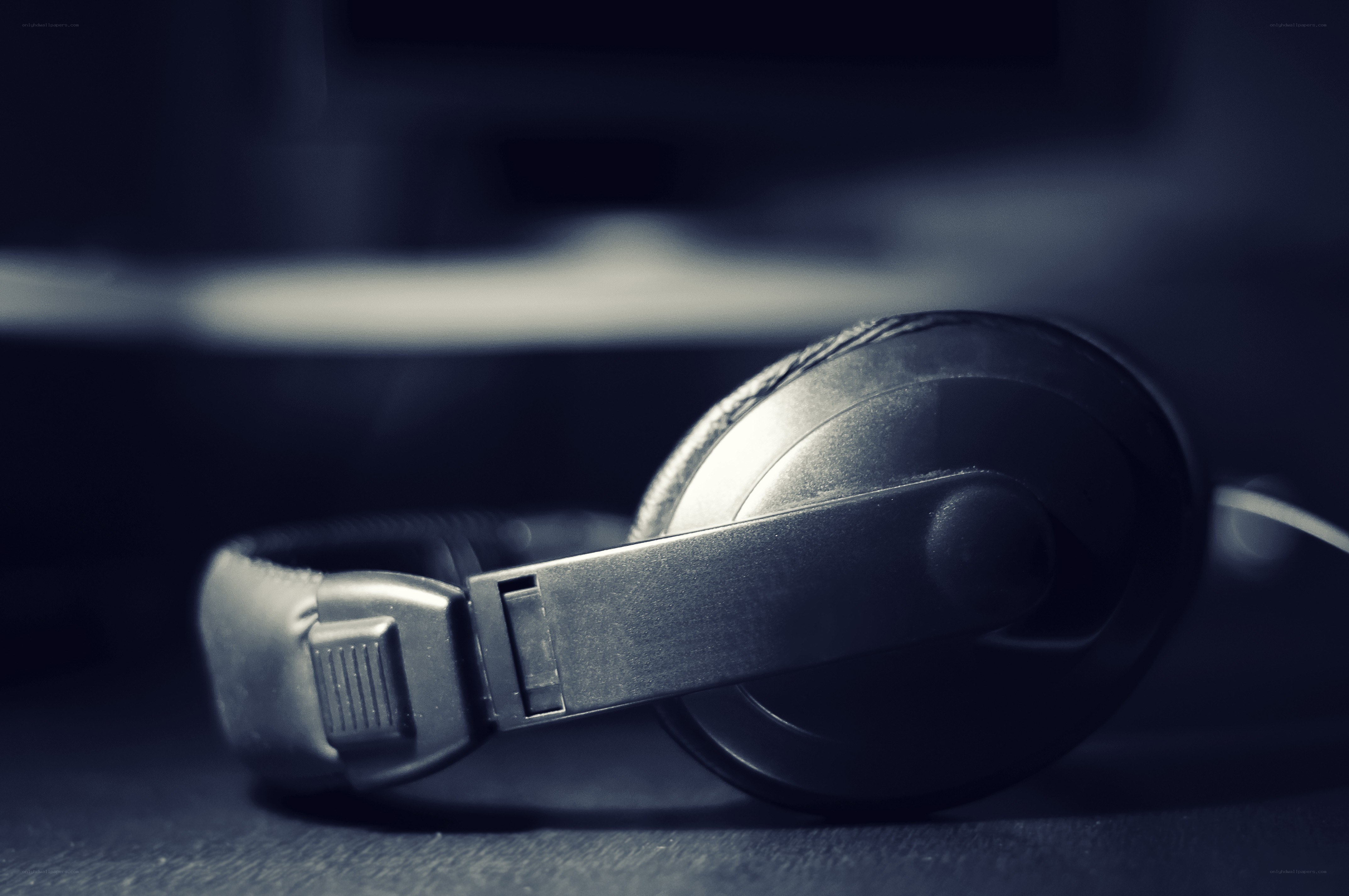 black headphones on dark surface