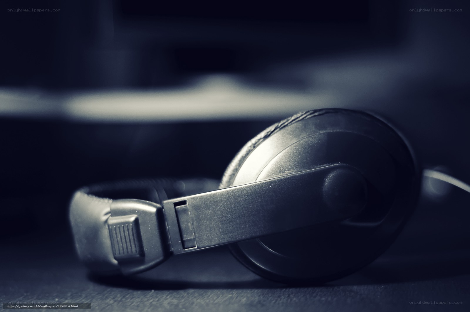 black headphones on dark surface