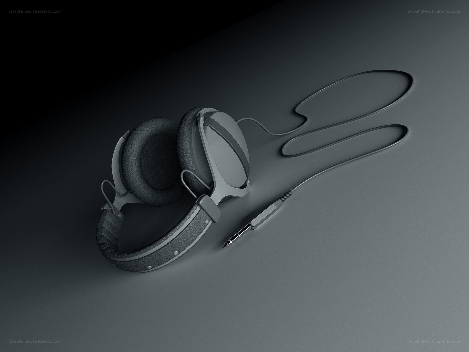 black headphones on gray surface