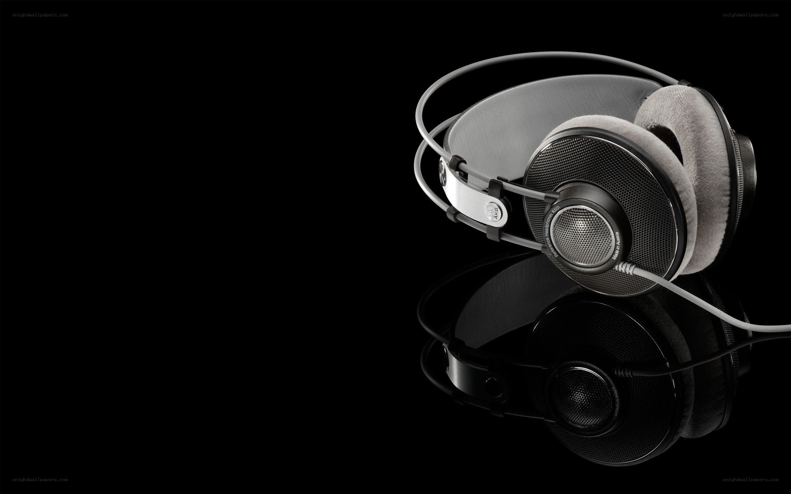 black headphones on reflective surface