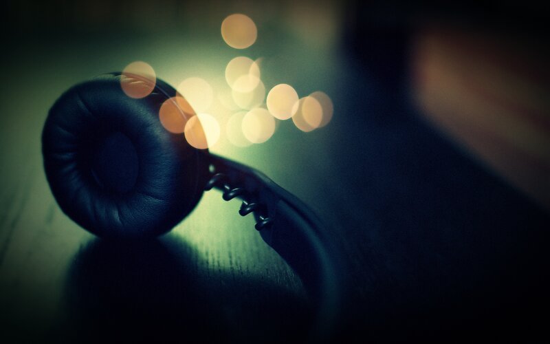 Black Headphones on Table — Moody