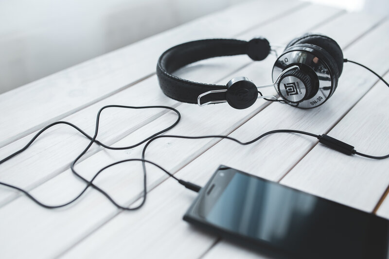 Black Headphones on Table — White