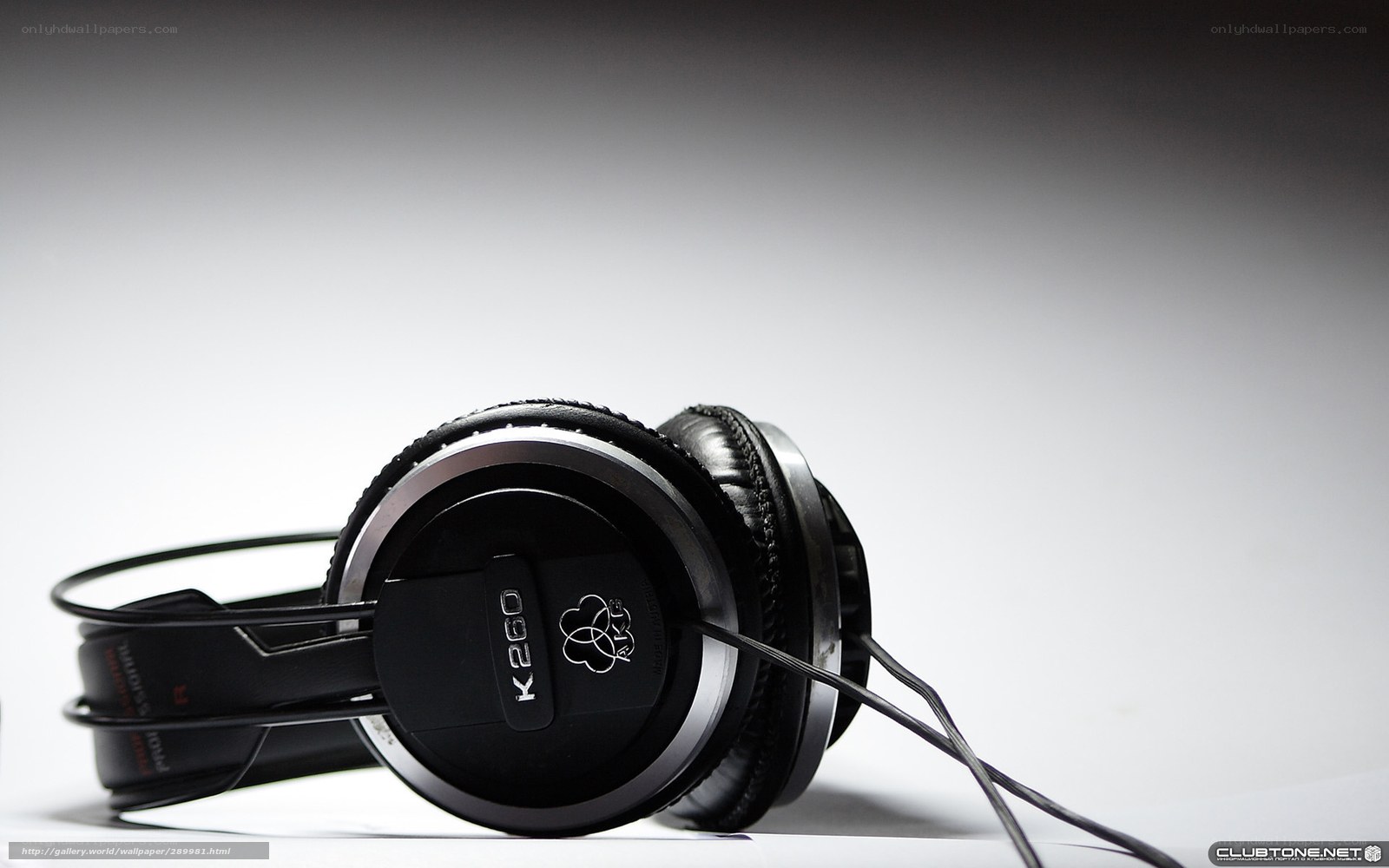 black headphones on white surface