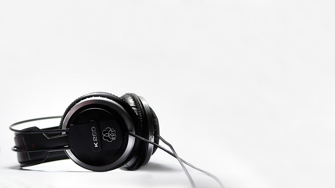black headphones on white surface