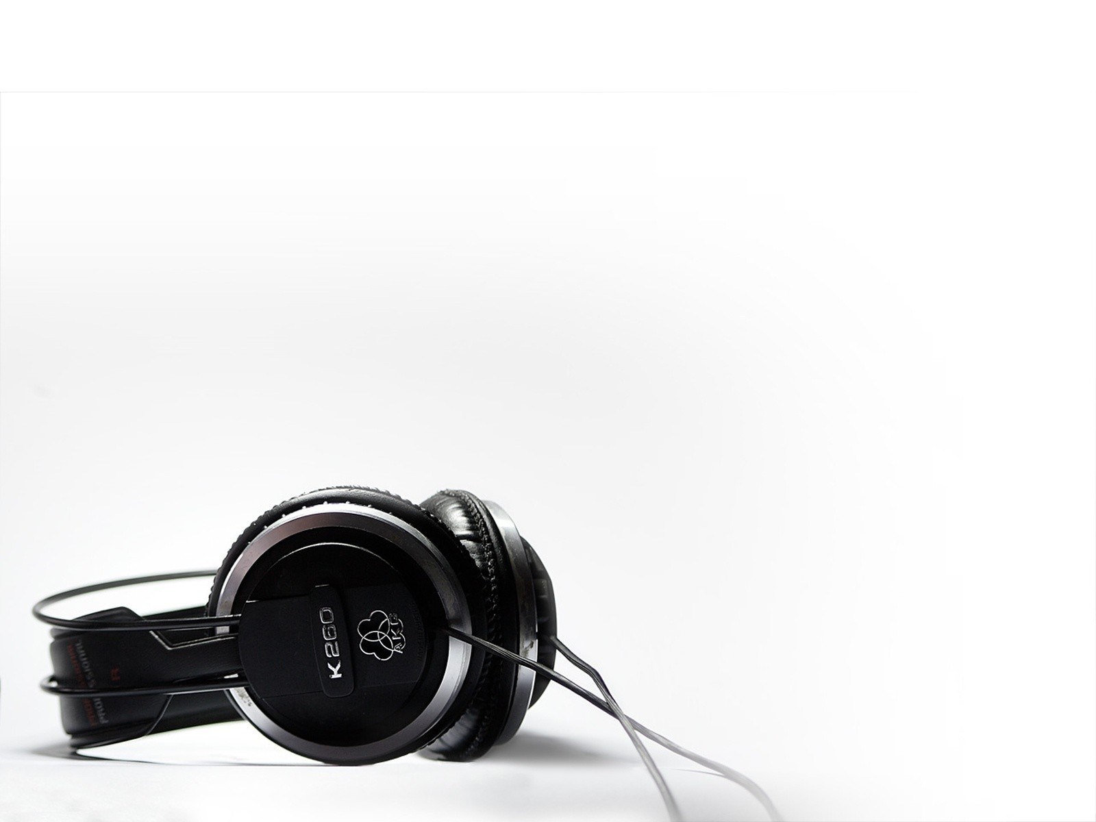 black headphones on white surface