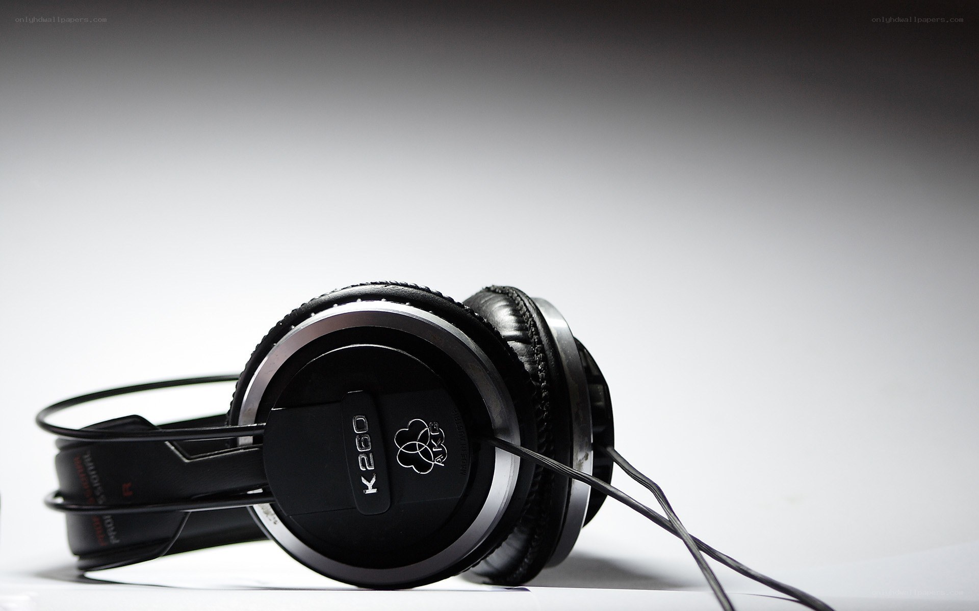 black headphones on white surface