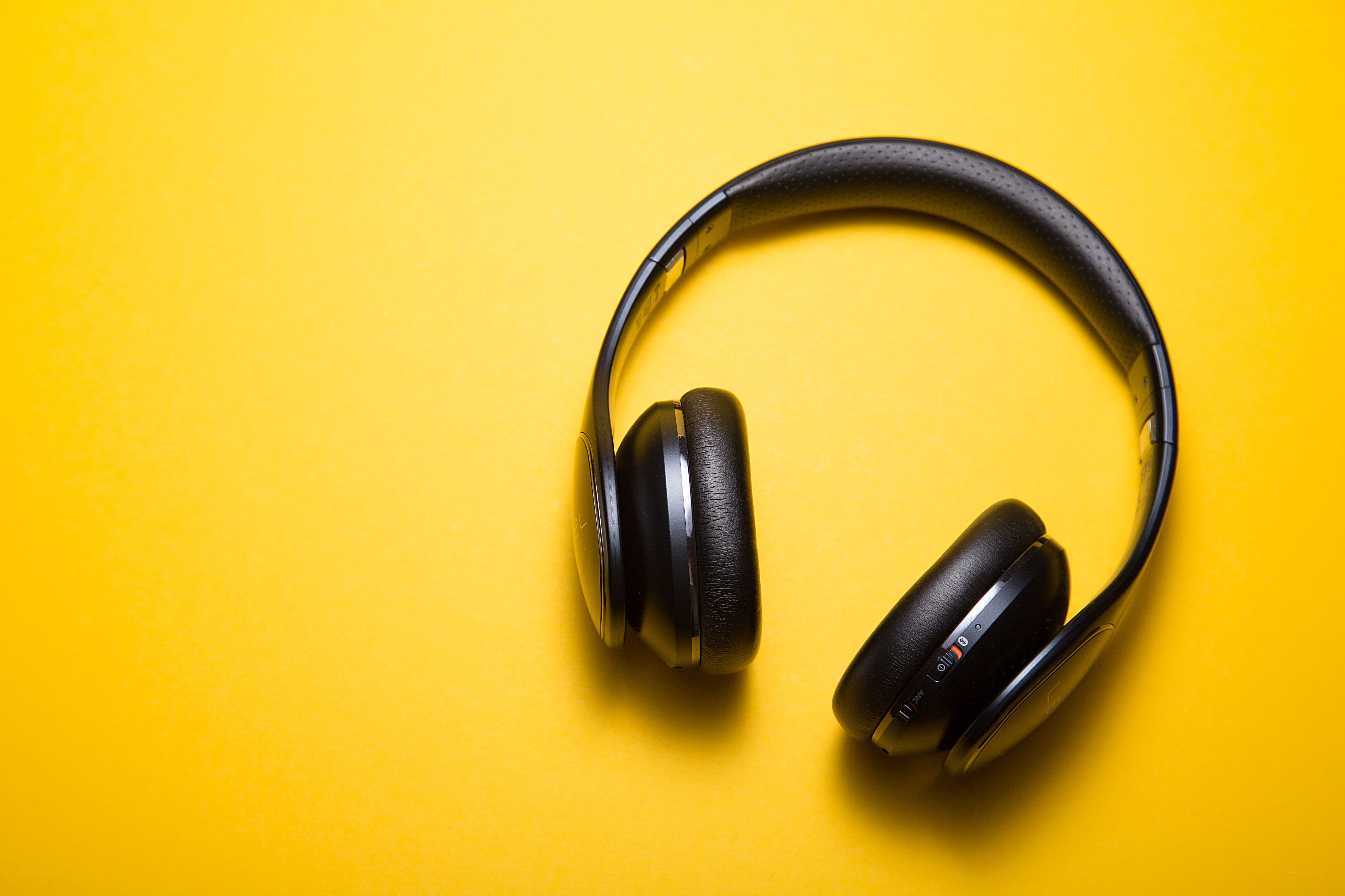 black headphones on yellow
