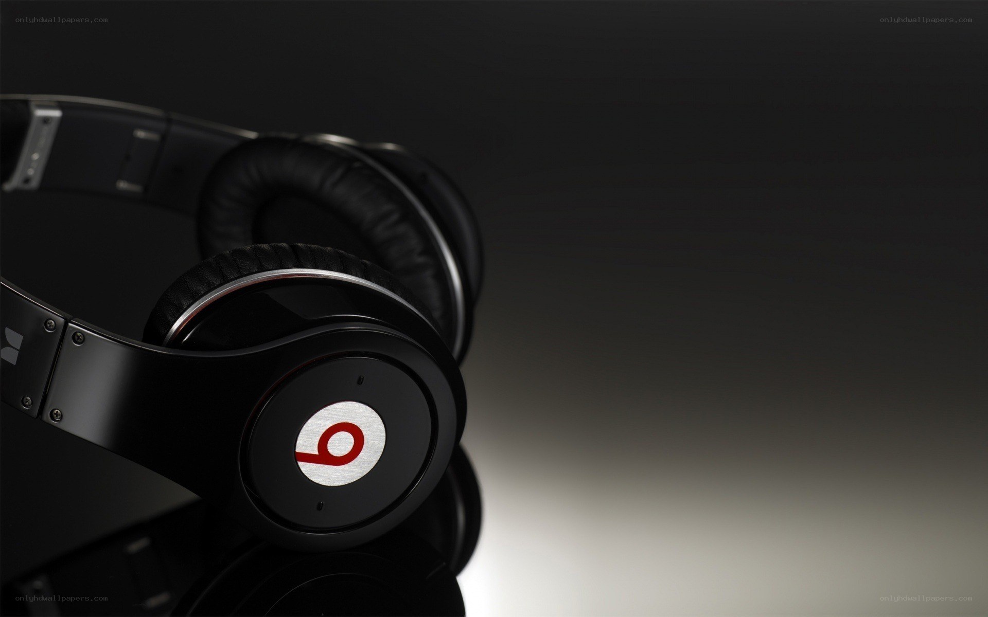black headphones with red logo