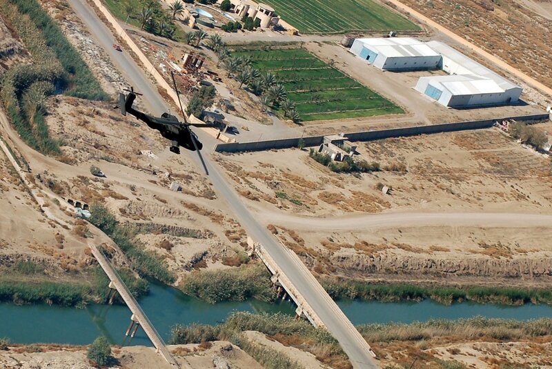Black Helicopter Flying — Brown