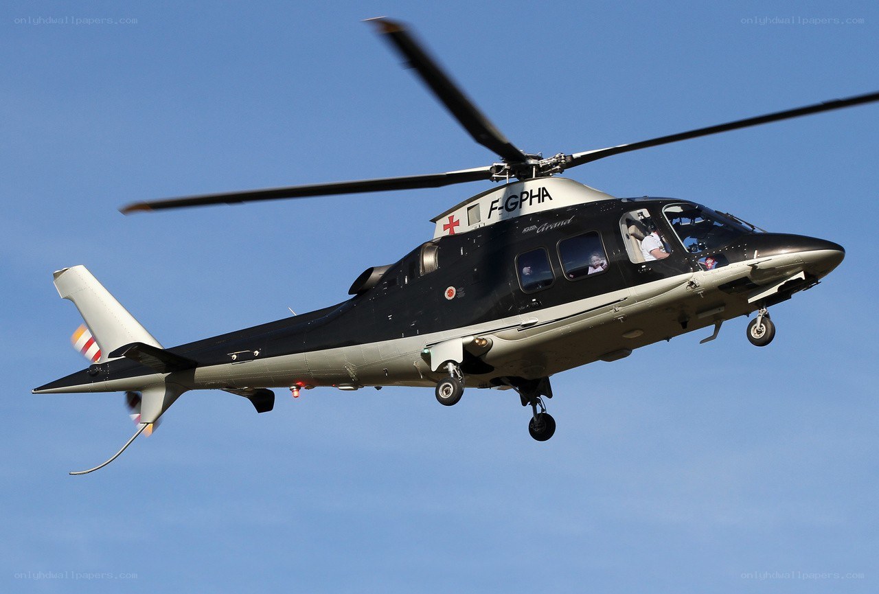 Black helicopter in flight