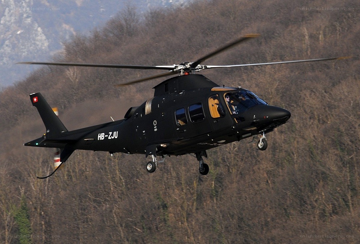 Black helicopter in flight
