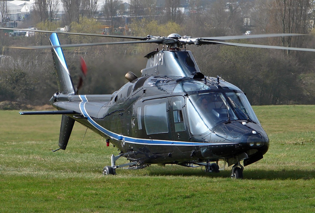 Black helicopter on grass field