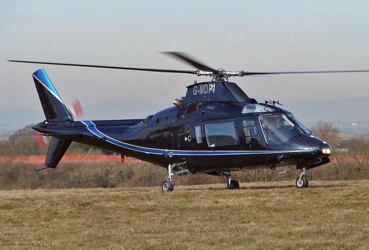 Black helicopter on grass field