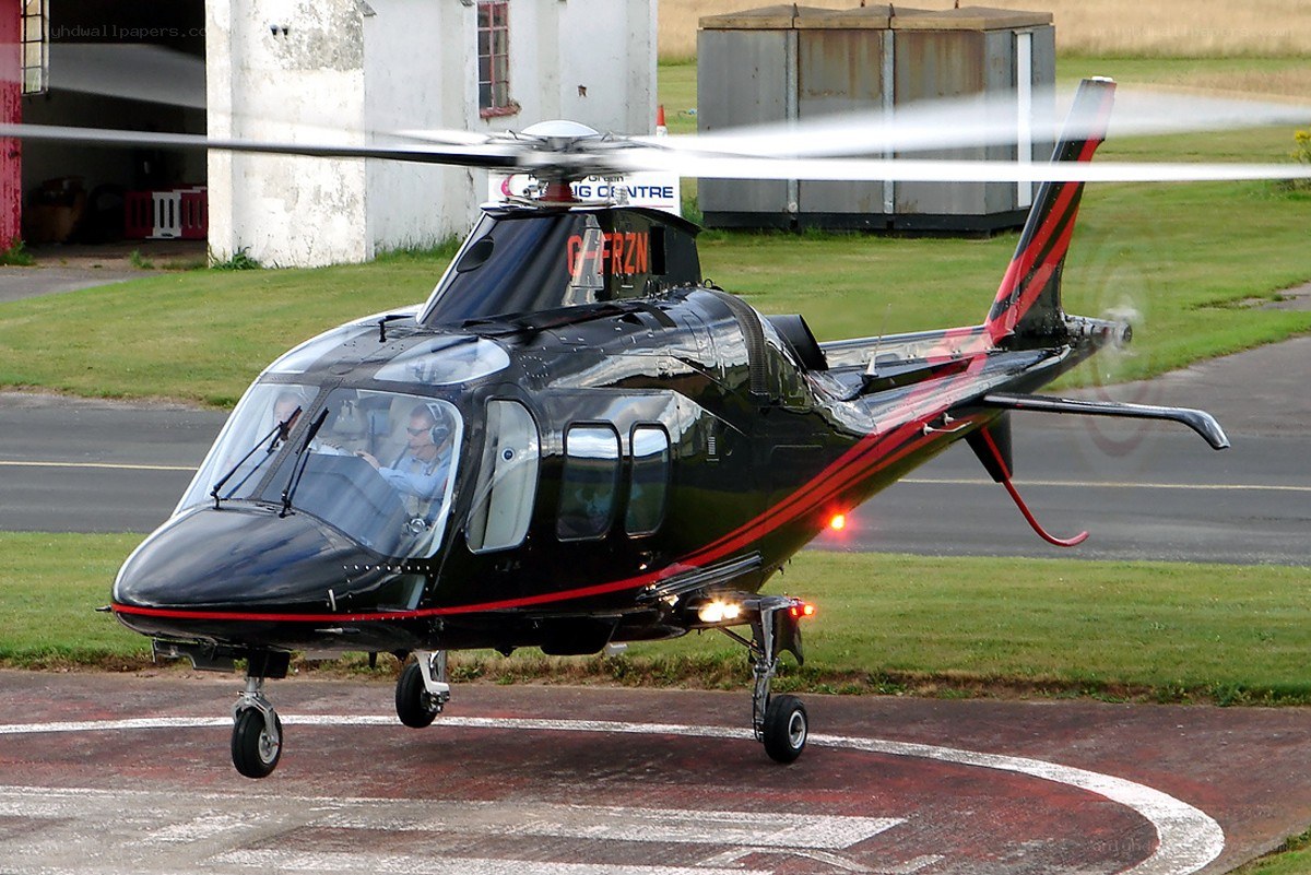 Black helicopter on helipad