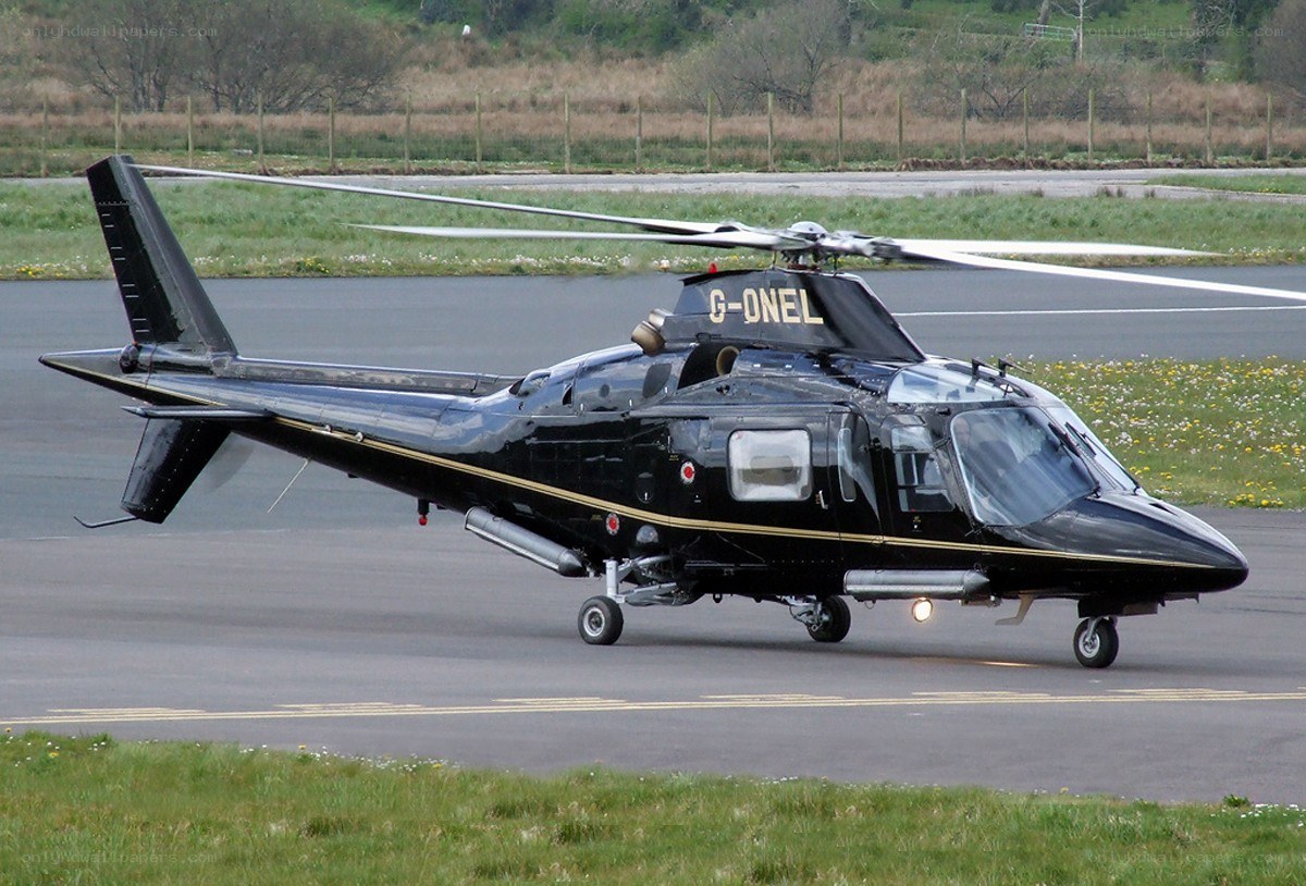 Black helicopter on runway