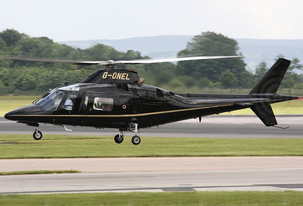 Black helicopter on runway