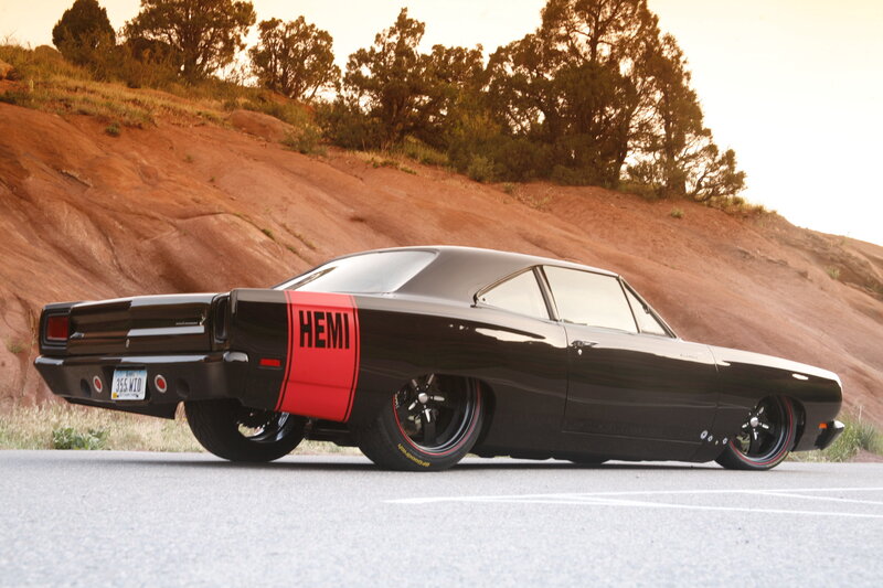 Black Hemi muscle car on road