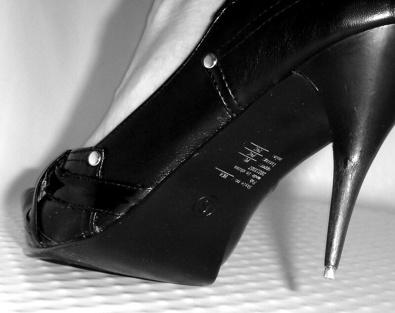 Black High-heeled Shoe — Dramatic