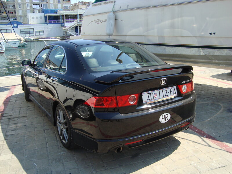 Black Honda Accord parked at marina