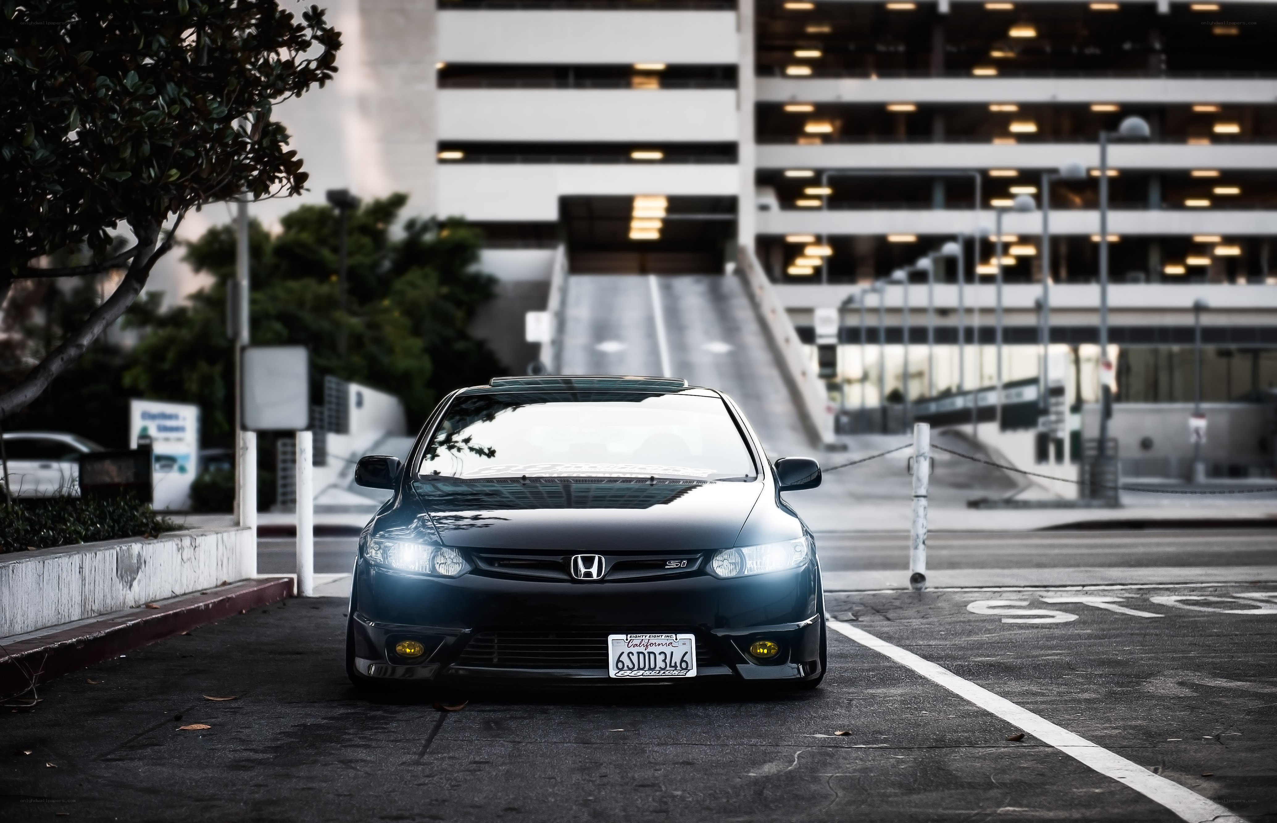 Black Honda Civic in parking lot