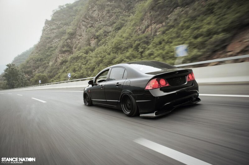 Black Honda Civic on mountain road