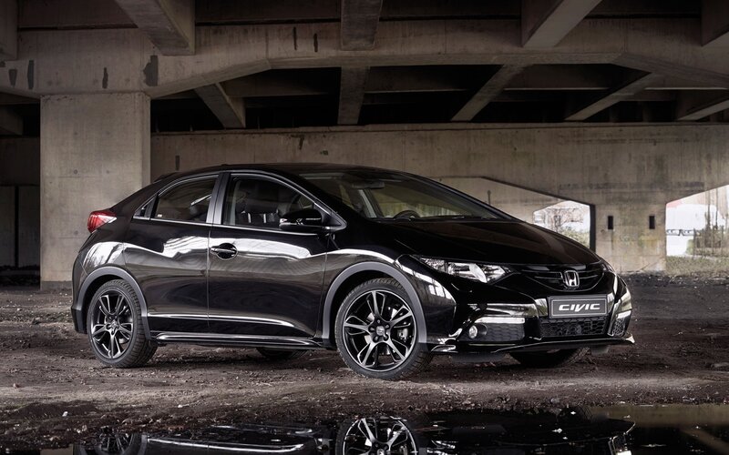 Black Honda Civic under bridge