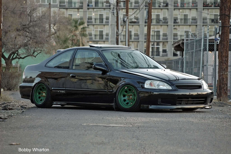 black honda civic with green wheels