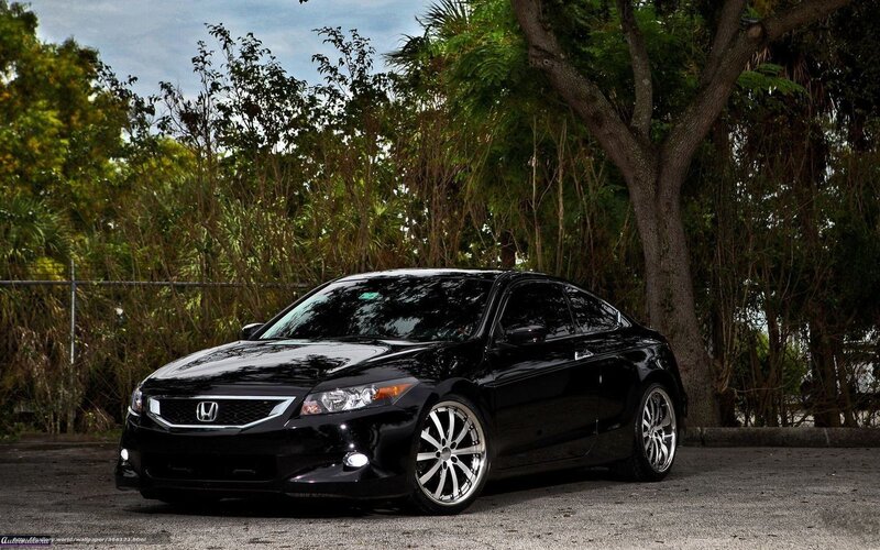 black honda coupe in parking lot