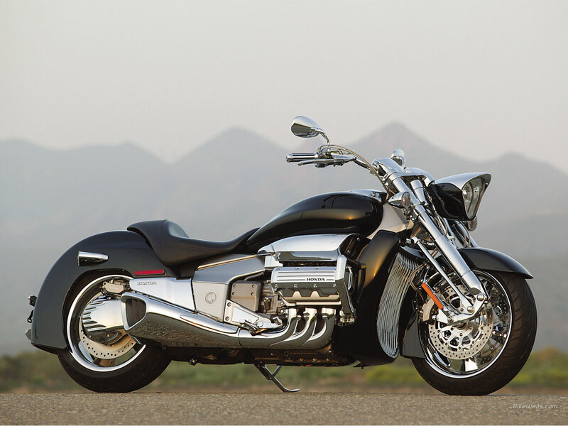 Black Honda motorcycle on road