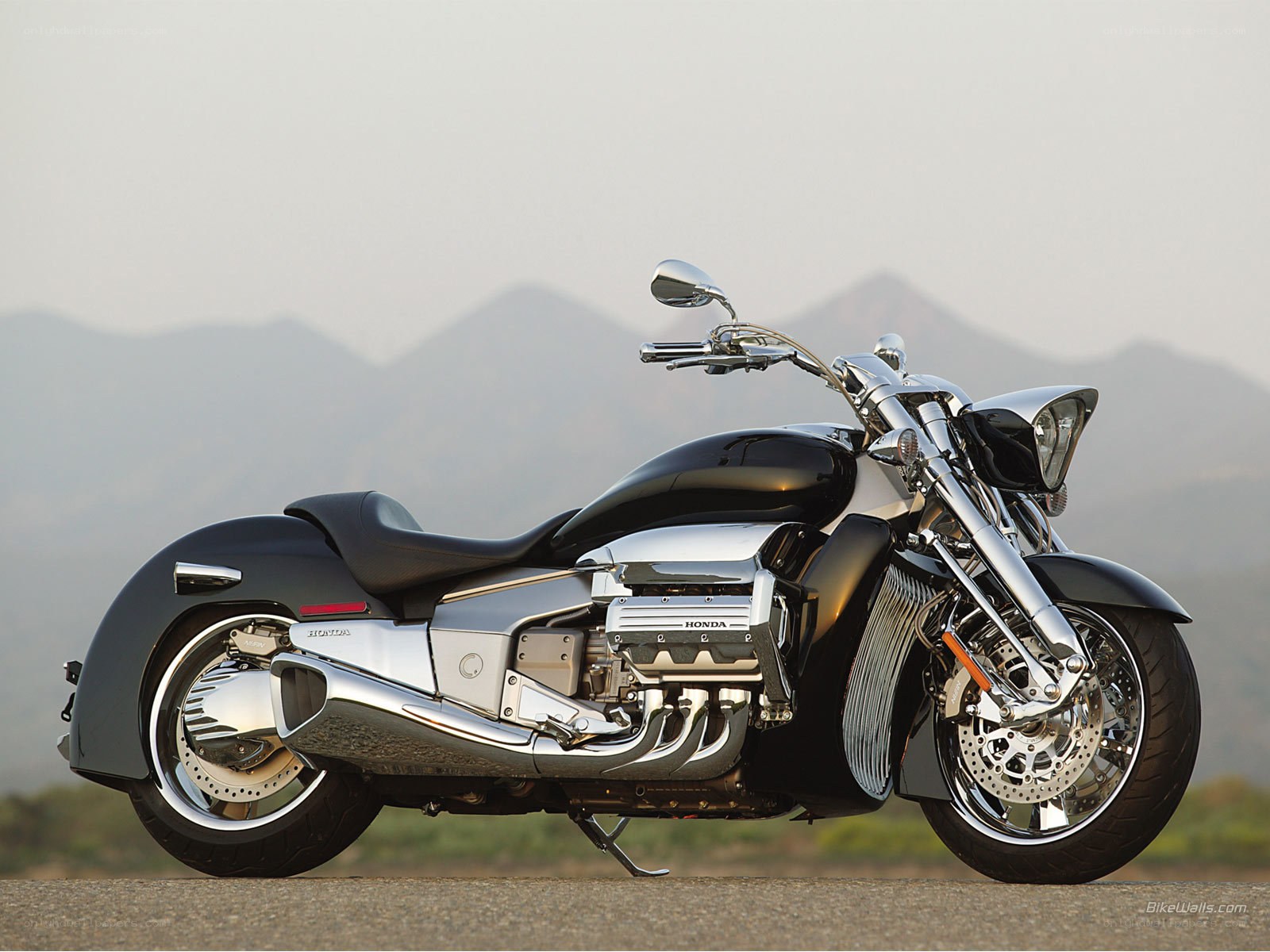 Black Honda motorcycle on road