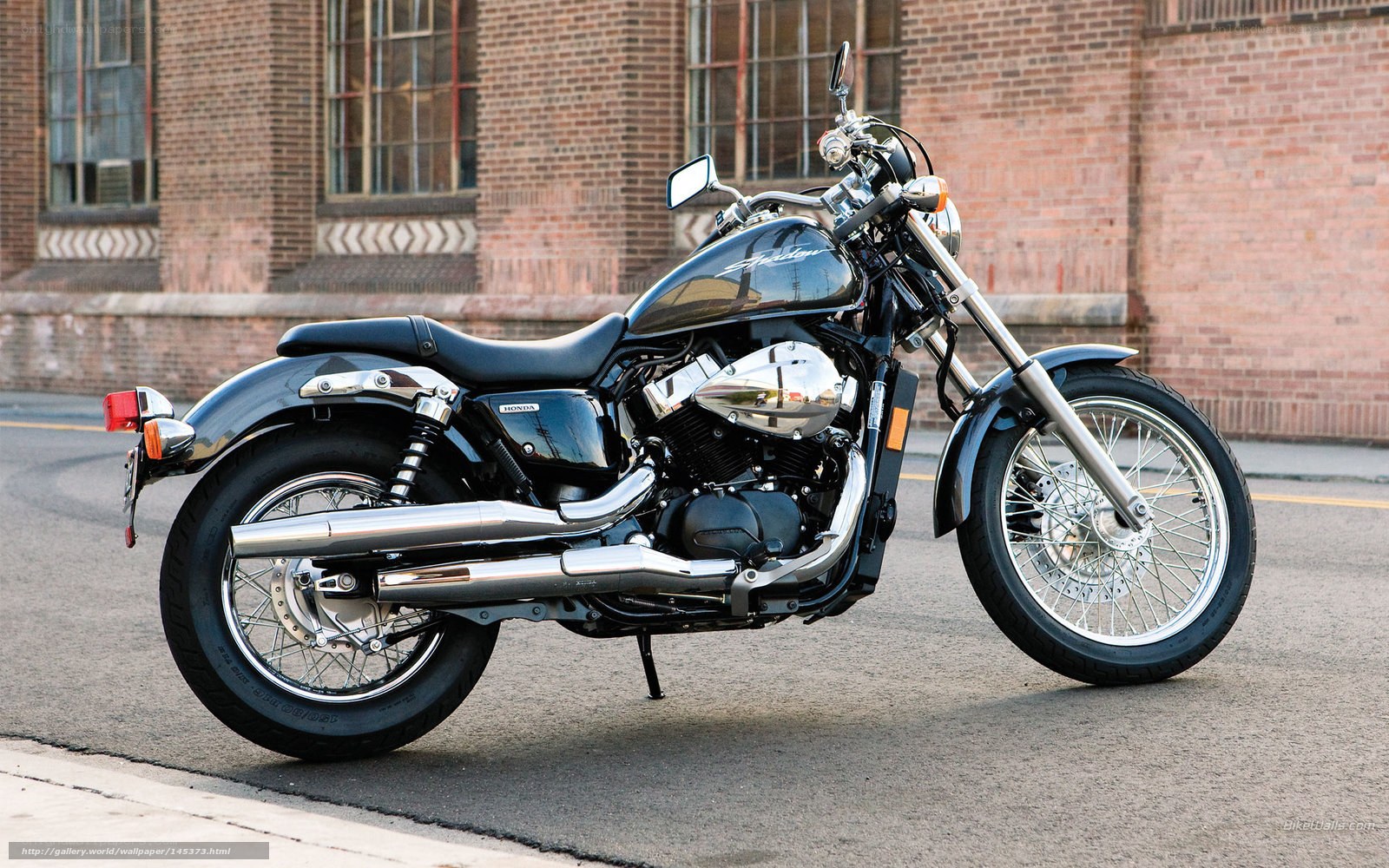 Black Honda motorcycle on street