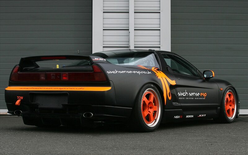 black honda nsx with orange accents