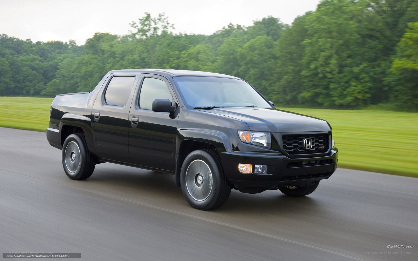 black honda ridgeline in motion