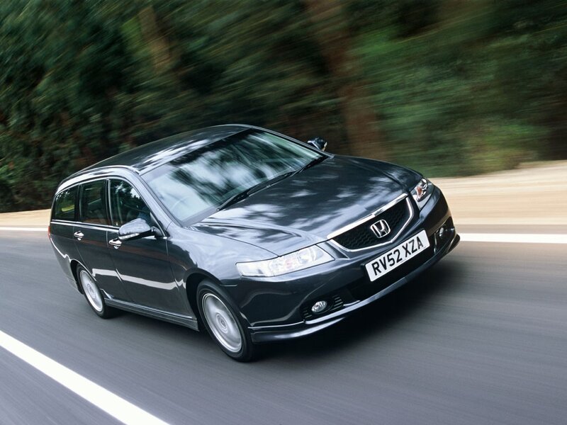 black honda station wagon in motion