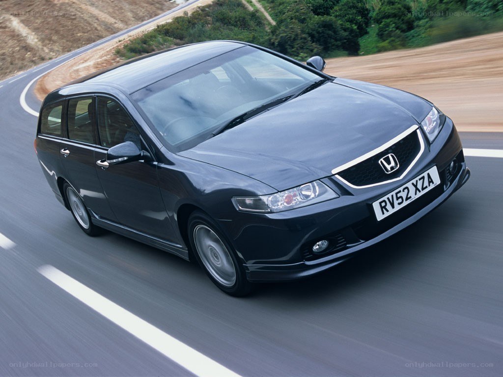 black honda station wagon on road