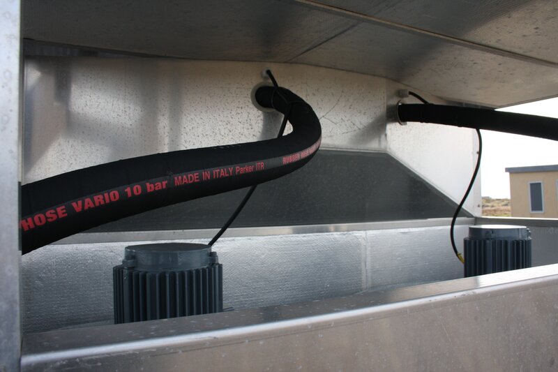 black hose in metal enclosure