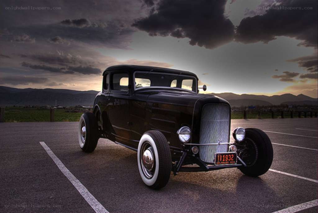 Black hot rod car at sunset