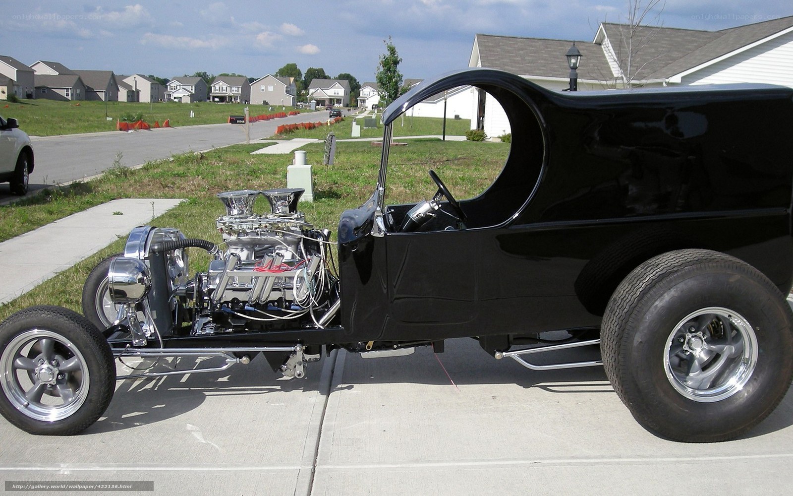 Black hot rod car on driveway