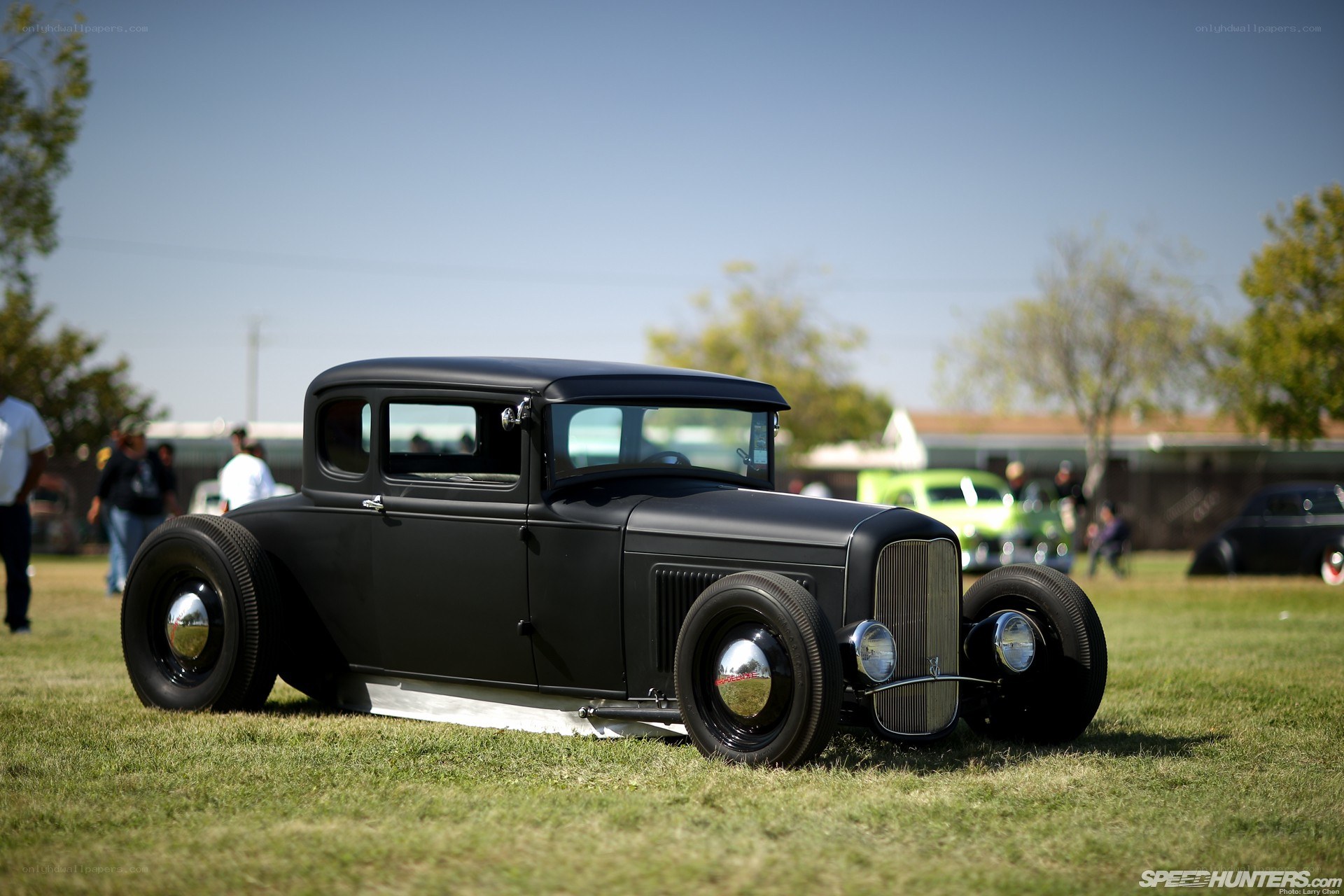 black hot rod on grass