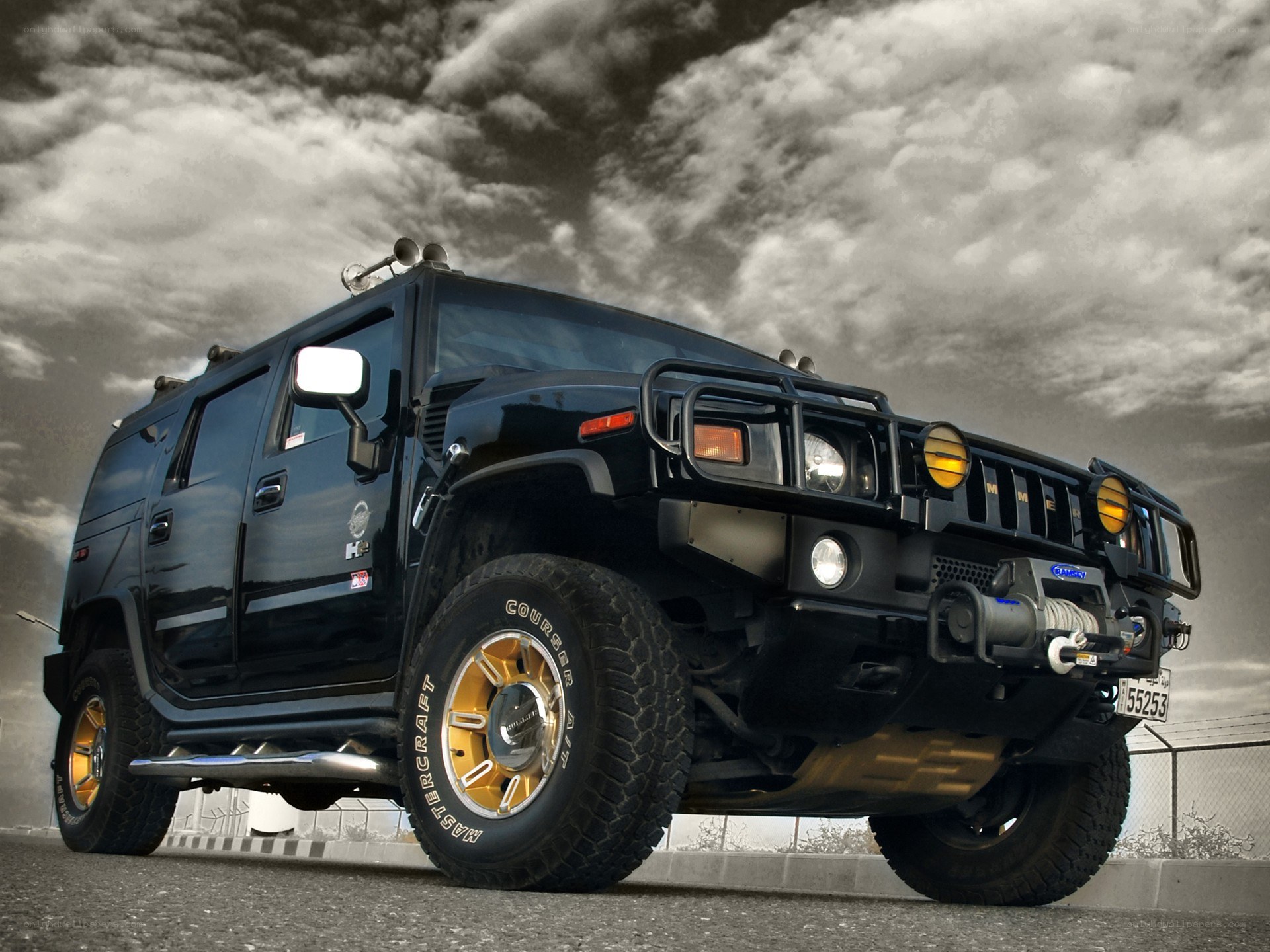 Black Hummer H2 with custom wheels